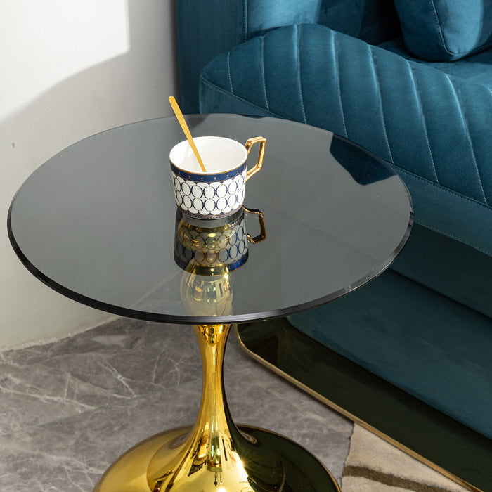 Modern minimalist Giga coffee table with steel legs and tempered glass top, showcasing a sleek side table design.