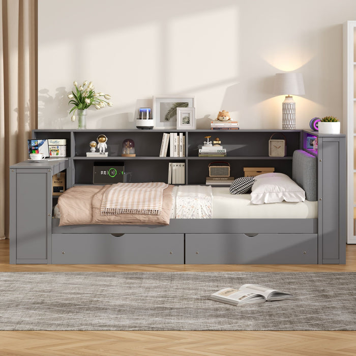 Giga platform storage bed with upholstered headboard, built-in desk, drawers, shelves, charging station, and LED lighting in a modern bedroom