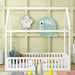 Giga wooden house bed with fence and door, platform style, featuring a cozy, natural wood finish perfect for a child's bedroom.