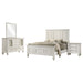 CoasterEveryday Sandy Beach 4-piece California king bedroom set in cream white with bed, dresser, mirror, and nightstand