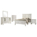 Cream white Sandy Beach 5-piece queen bedroom set by CoasterEssence, featuring a bed frame, nightstands, dresser, and mirror.