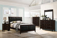 Full view of Carlton Wood Full Panel Bed in Cappuccino finish, showcasing the furniture's classic design and wood construction.