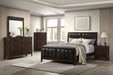 CoasterEveryday Carlton Wood Queen Panel Bed in Cappuccino finish, showcasing the elegant wooden headboard and frame design.