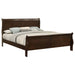 Louis Philippe wood Eastern King sleigh bed in cappuccino finish, showcasing the elegant furniture design and curved headboard.