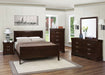Louis Philippe wood Eastern King sleigh bed in cappuccino finish, showcasing curved headboard and classic furniture design