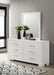 CoasterEssence Jessica 6-drawer dresser with mirror in snow white, showing the sleek furniture with mirror attached.