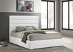 White Felicity 53-inch upholstered Eastern King platform bed by CoasterEveryday with a padded headboard and sleek design.