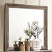 Kauffman dresser mirror in washed taupe with a rectangular frame, showcasing its stylish furniture design and finish.