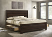 California King storage panel bed by CoasterEveryday in dark cocoa wood with built-in storage drawers and a modern furniture design.