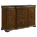 CoasterEveryday 4-piece Queen bedroom set in brown cherry finish, includes bed frame, nightstands, and dresser with detailed woodwork.