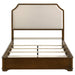 Cream and brown cherry 58-inch Queen Panel Bed by CoasterEveryday showing the upholstered headboard and wooden frame.