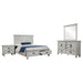 Franco 4-piece Eastern King bedroom furniture set in distressed white by CoasterEssence, featuring a bed frame, nightstands, and dresser.