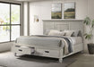 Distressed white Franco Wood Eastern King Storage Panel Bed by CoasterEssence, showcasing the elegant wooden bed with storage drawers.