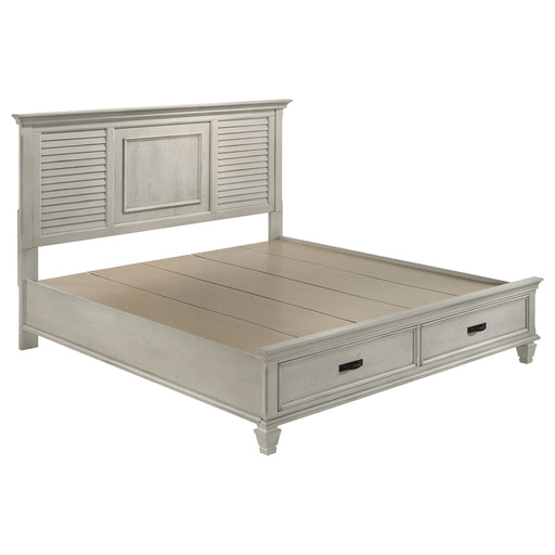 Franco Wood Eastern King Storage Panel Bed by CoasterEssence in distressed white finish, showcasing the elegant headboard and storage drawers.