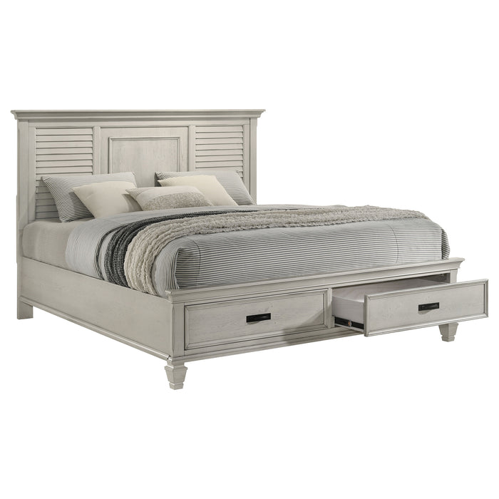 Distressed white Franco Wood Eastern King Storage Panel Bed by CoasterEssence, showcasing the elegant wooden bed with storage drawers.