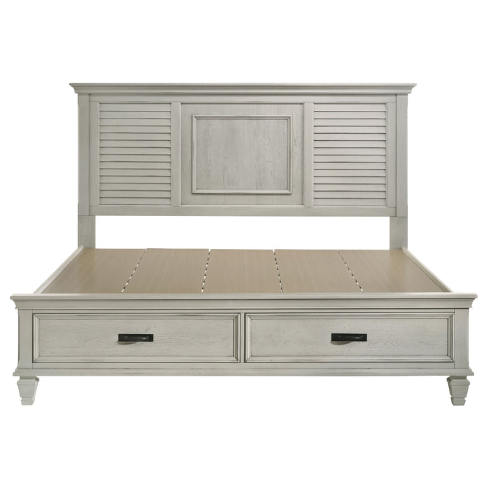 Distressed white Franco Wood Eastern King storage panel bed by CoasterEssence, showing the detailed wooden headboard and frame.