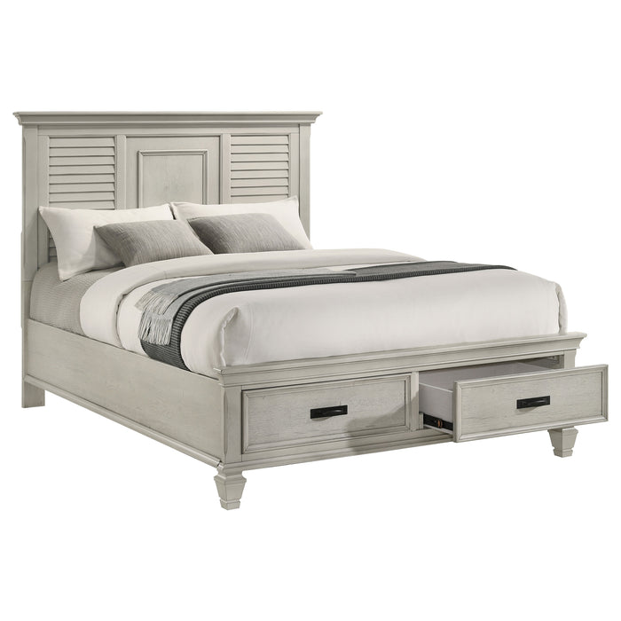 Distressed white Franco Wood Queen Storage Panel Bed by CoasterEssence, showcasing the headboard and storage panels in a bedroom setting.