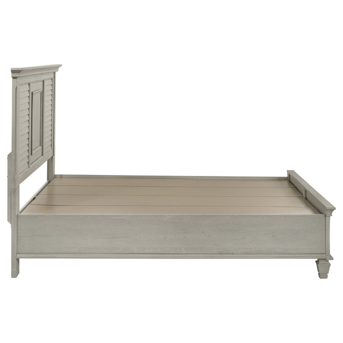 Distressed white Franco Wood Queen Storage Panel Bed by CoasterEssence, showcasing a classic wooden bed with built-in storage drawers.