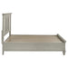 Distressed white Franco Wood Queen storage panel bed by CoasterEssence showcasing the headboard and footboard in a stylish bedroom setting.