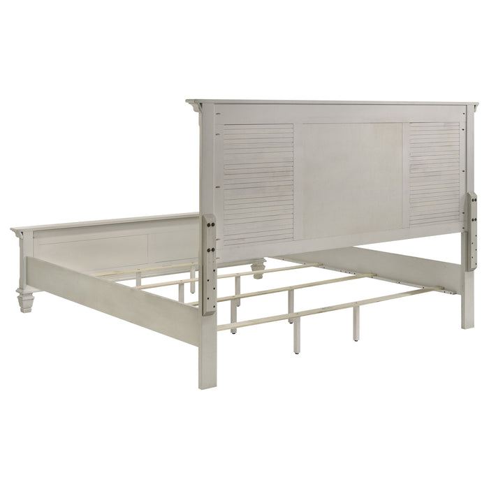 Distressed white Franco Wood Eastern King Panel Bed by CoasterEssence, showcasing a sturdy wooden furniture piece with panel details.