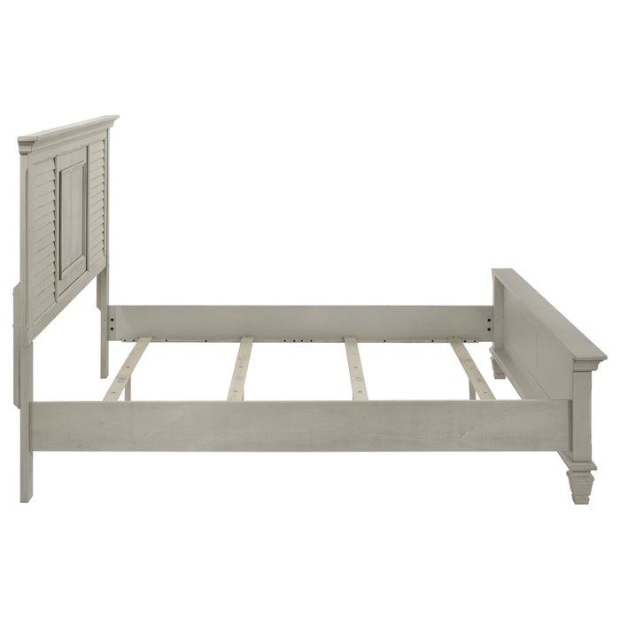 Distressed white Franco Wood Eastern King Panel Bed by CoasterEssence, showcasing a wooden bed frame with panel headboard and elegant design.