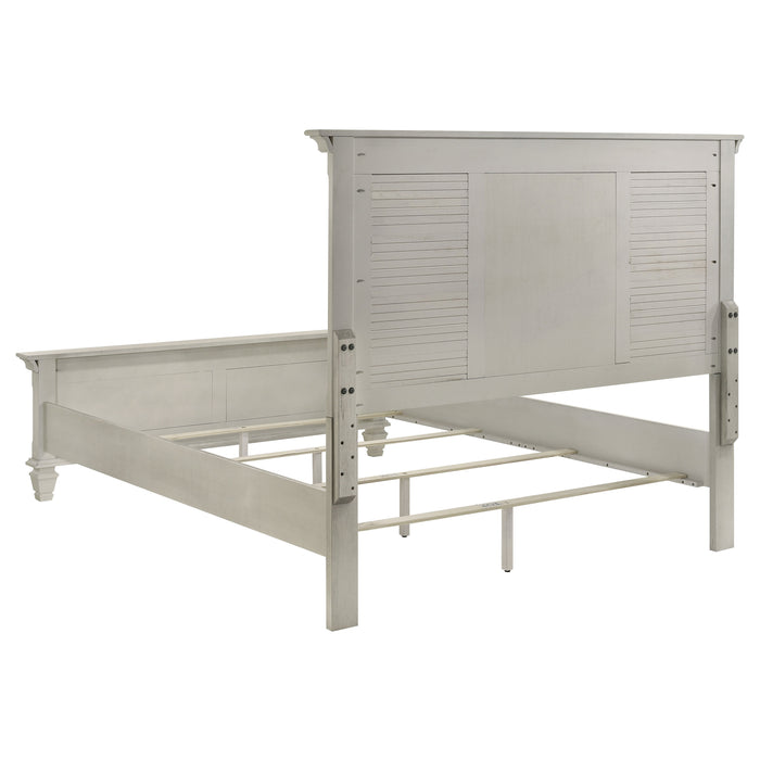 Distressed white Franco Wood Queen Panel Bed by CoasterEssence, showcasing a classic wooden bed frame with detailed panel headboard.