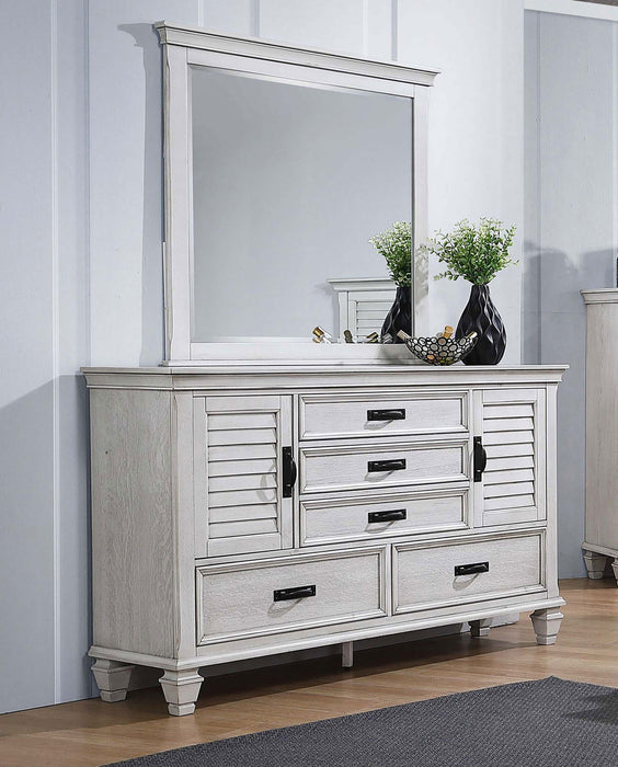 CoasterEssence Franco 5-drawer dresser in distressed white with attached mirror, showcasing furniture design and elegant storage.