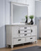 CoasterEssence Franco 5-drawer dresser in distressed white with attached mirror, showcasing furniture design and elegant storage.