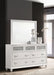 White Barzini 7-drawer dresser with attached mirror, showcasing sleek furniture design from CoasterEveryday.