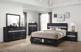 Miranda 51-inch black wood Eastern King storage panel bed by CoasterEveryday, featuring a sleek black finish and built-in storage drawers.