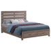 CoasterEveryday Brantford Wood Queen Storage Panel Bed in Barrel Oak with a sturdy wooden frame and storage drawers.
