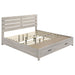 CoasterEveryday Brantford 5-piece Eastern King bedroom set in coastal white, featuring a bed, nightstands, dresser, and mirror.