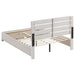 CoasterEveryday Brantford Wood Queen Storage Panel Bed in Coastal White, showcasing the headboard and storage drawers in a modern bedroom setting.