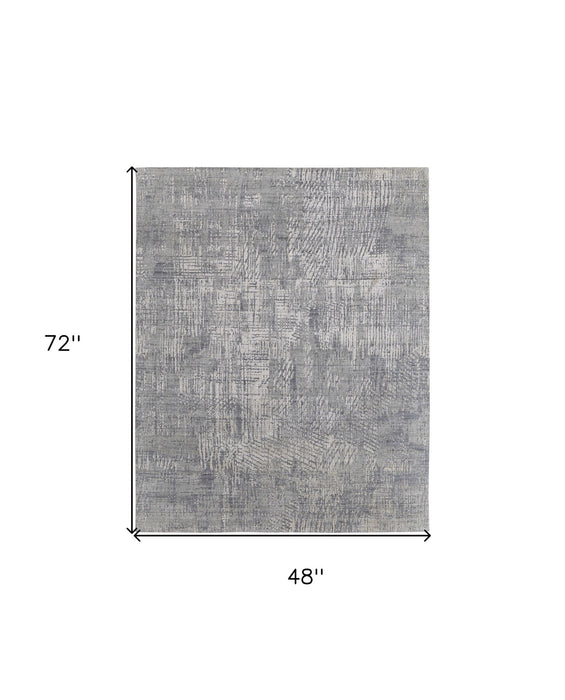 4' x 6' Casual Abstract Hand Woven Worn Faded Area Rug - Gray