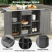 Giga outdoor kitchen island with stainless steel top, storage, towel and spice racks, and a bottle opener, designed for outdoor cooking.