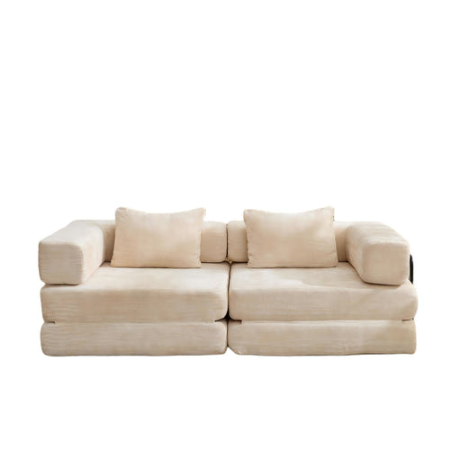 Giga convertible floor sofa bed with pillow back support and armrest, showcasing its versatile futon design and plush cushions.