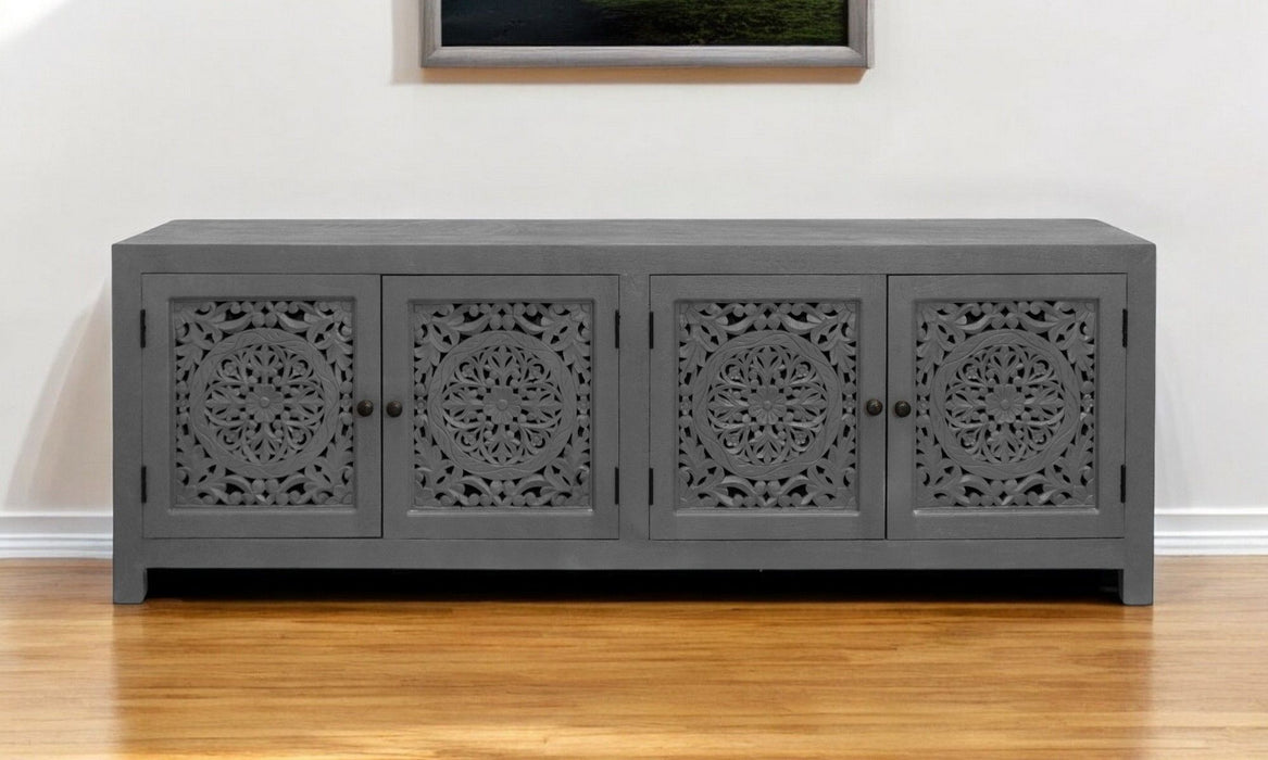 Dark gray 86-inch carved floral distressed solid wood TV stand with enclosed storage and decorative detailing.