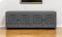 Dark gray 86-inch carved floral distressed solid wood TV stand with enclosed storage and decorative detailing.