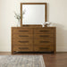 CoasterEveryday Adderley 8-drawer bedroom dresser with matching mirror in warm brown wood finish, showcasing sleek furniture design.