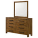 CoasterEveryday Adderley 8-drawer bedroom dresser with mirror in warm brown wood finish, showcasing spacious drawers and elegant design.