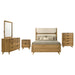 CoasterEveryday Bennett Eastern King upholstered 5-piece bedroom set with light oak finish, includes bed, nightstands, and dresser.