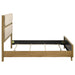 Light oak Bennett Queen Mid-Century Fabric Upholstered Panel Bed by CoasterEveryday, showing the headboard and frame.