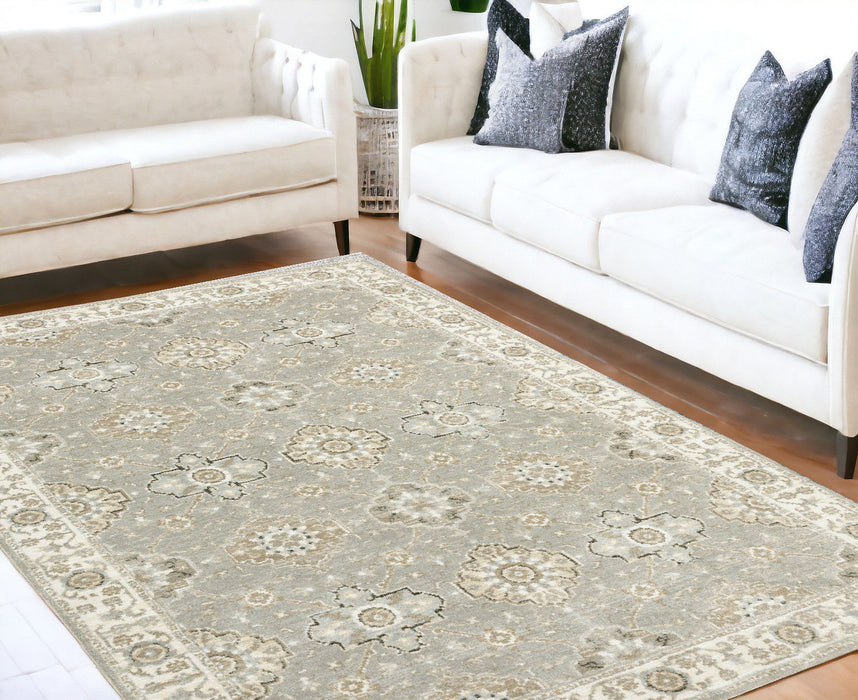 5.3' x 7.6' Oriental Power Loom Area Rug - Gray And Ivory