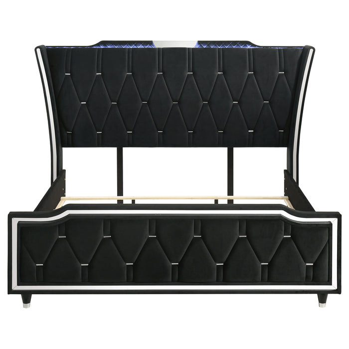 Black California King LED upholstered bed from CoasterEveryday featuring a modern, padded headboard and sleek furniture design.