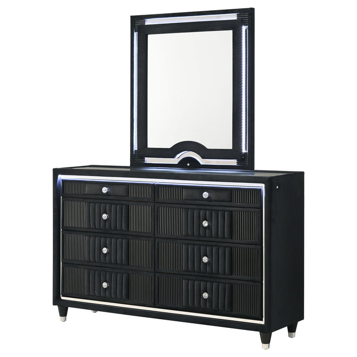Black Ravenne 8-drawer velvet upholstered LED dresser with mirror, featuring sleek furniture design and modern LED lighting.