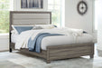 Brown oak upholstered queen bed frame with a cushioned headboard and wooden legs, modern furniture design.