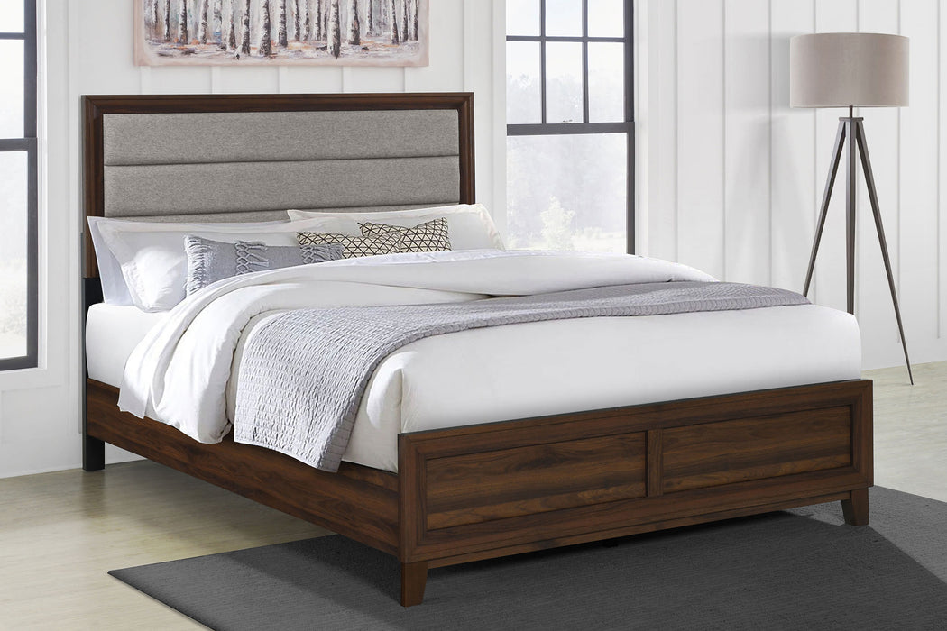 Walnut upholstered California King bed from Welsley collection, featuring a sturdy wooden frame and plush headboard.