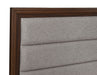 Walnut upholstered Queen bed frame from Welsley collection with padded headboard and wooden legs, featuring a modern furniture design.