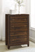 Walnut Welsley 4-drawer chest of drawers by CoasterEveryday, showing the furniture with four spacious drawers and sleek design.