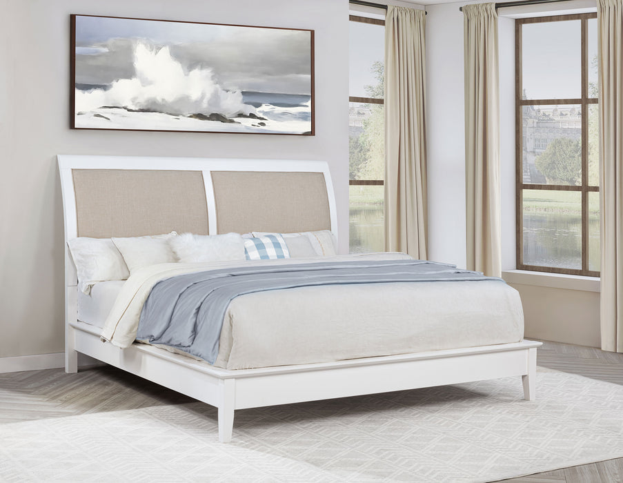 White upholstered Eastern King panel bed by CoasterEveryday featuring a sleek, modern design with a tall headboard and clean lines.
